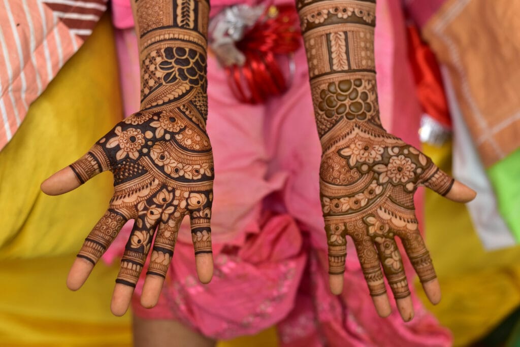 The Art and Tradition of Mehndi Design: A Journey of Beauty and Culture 3 indian bride showing hands mehndi design 2023 11 27 04 56 28 utc 1